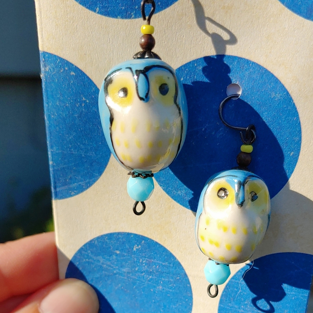 Handmade Blue Ceramic Owl Earrings on Dark Brass